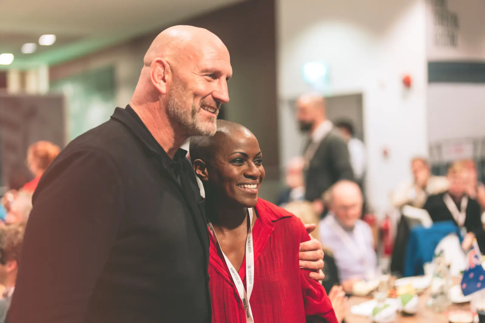The Green Room host speaking with guests at a hospitality event.